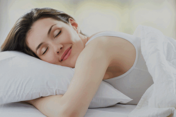 Woman sleeping on pillow Nest by Nature